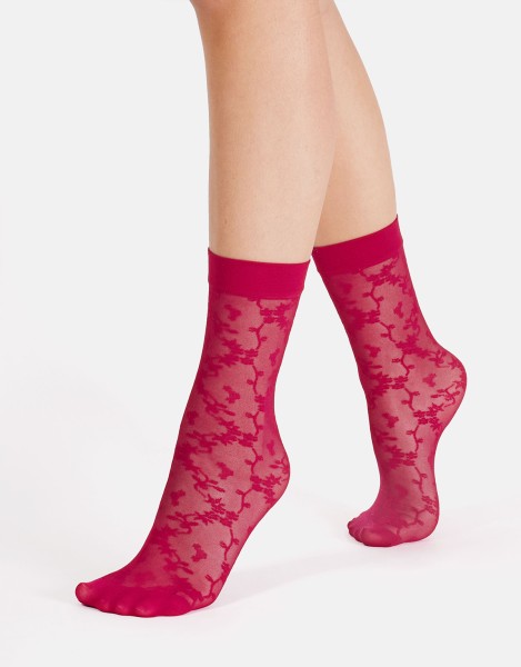 Cette - Sheer socks with a floral pattern